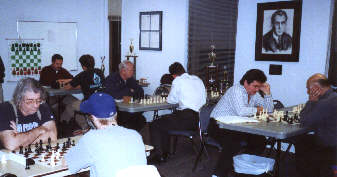 adults playing chess at Chess Center